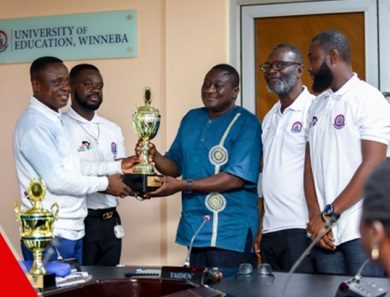 Uew Sports Contingent presents Trophies To Prof Avoke  