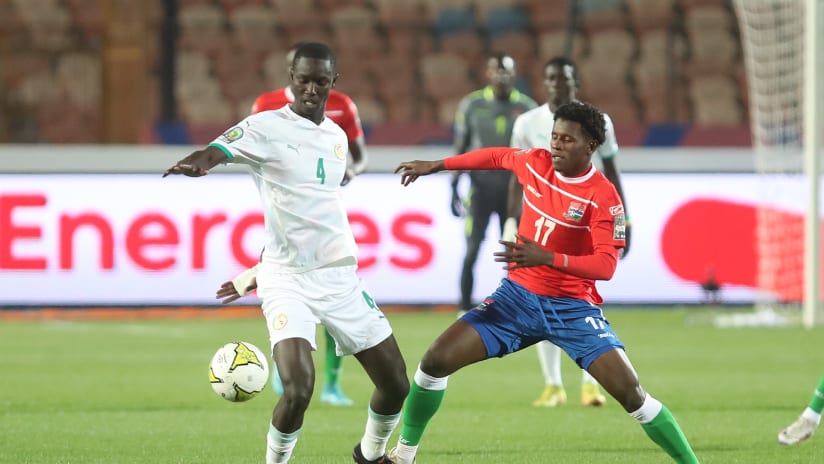 Mamadou Camara of Senegal Alieu Gibba of Gambia during the 2023 Africa Cup of Nations final match between Senegal and Gambia held at Cairo Inter